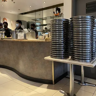 Thali plates lined up for service