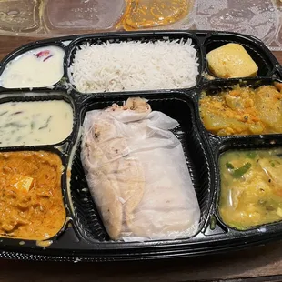 The vegan thali had paneer (bottom left). Paneer is cheese, and is dairy.