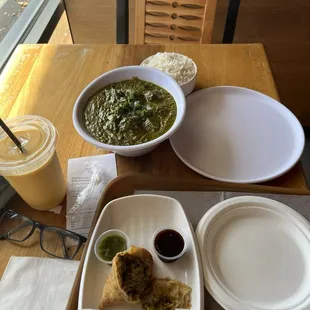 Vegetable samosa and palak paneer with a mango Lasi