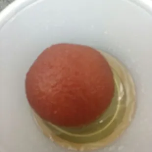 a tomato in a bowl