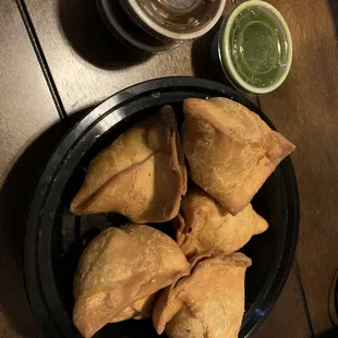 Two orders of samosa with tamarind and mint chutney