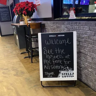a welcome sign in a restaurant