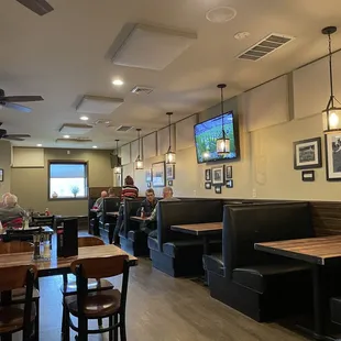Seating area, bar seating to the left of the building