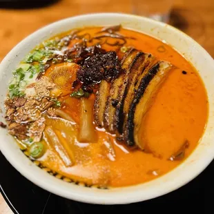 a bowl of ramen and vegetables