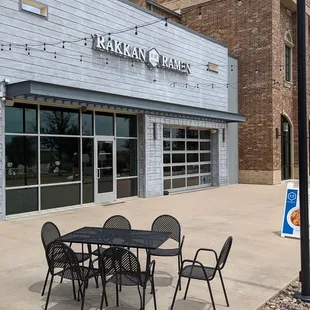 a table and chairs outside a restaurant