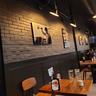 people sitting at tables in a restaurant