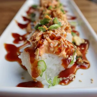 Kanikama Sushi Bites come topped with savory teriyaki sauce and crunchy fried onions!