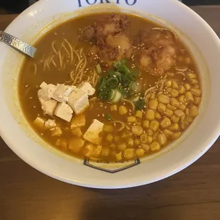 Spicy curry ramen with chicken, tofu, and corn