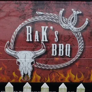a red truck with a bull skull on it