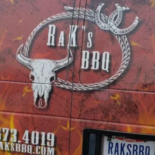 the back of a van with the raks bbq logo on it
