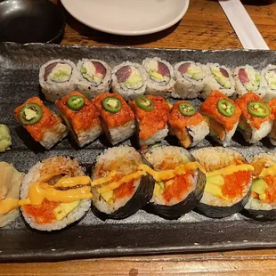 a platter of sushi and rolls
