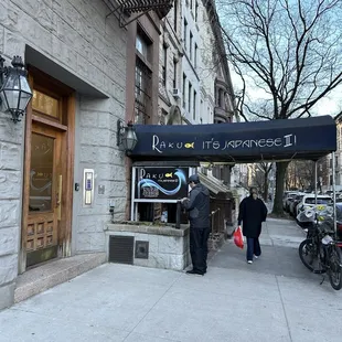 people walking down the sidewalk