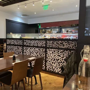 a view of a dining area with tables and chairs