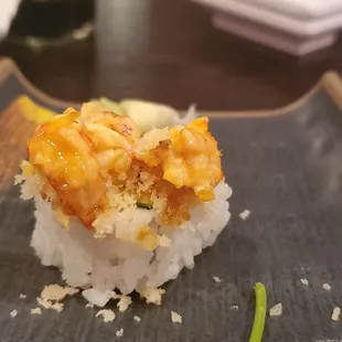 a piece of sushi on a plate