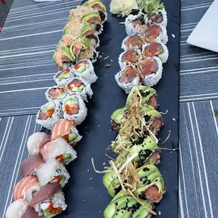 Rainbow roll, green dragon, black snake, salmon California