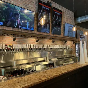 a bar with beer taps