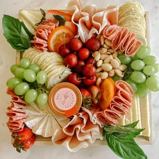 a platter of fruit and cheese