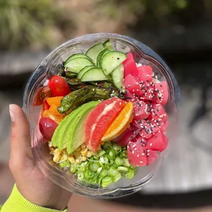 a person holding a bowl of food