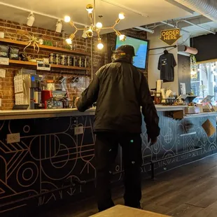 a man standing at a bar