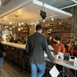 customers at the counter of a restaurant