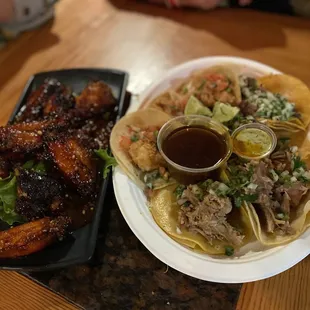 a plate of tacos and fries