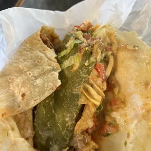 This is supposedly a chile verde burrito with added potatoes and beans.