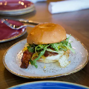 Rally Egg Sando - crisp smoked bacon, arugula, tillamok cheddar, spicy mayo, pepperoncini