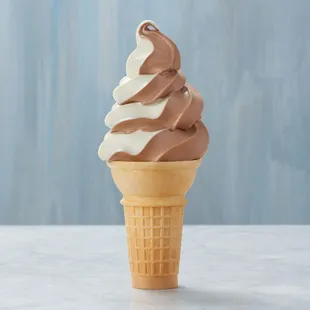 Classic cone filled with chocolate vanilla swirl soft-serve ice cream.