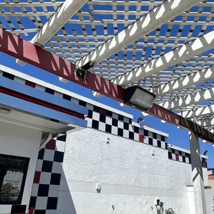 a red, white and black checkered awning