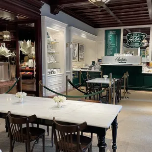 a table and chairs in a coffee shop