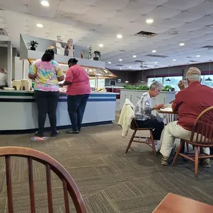 a group of people in a restaurant