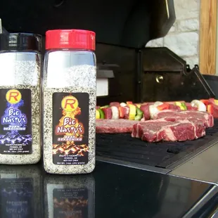 two steaks on a grill