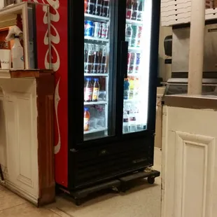 a coke cooler in a kitchen