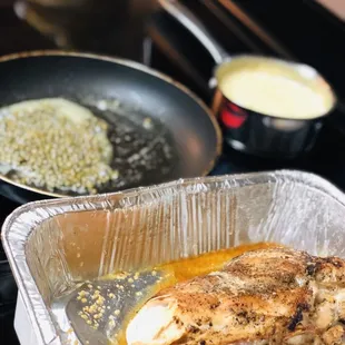 a pan of food cooking on a stove