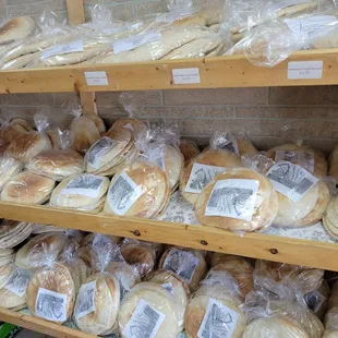 a variety of breads on shelves