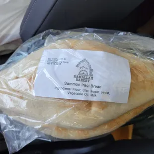 a bag of bread wrapped in plastic
