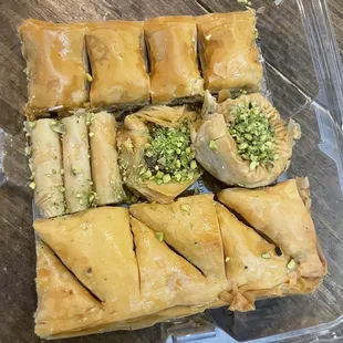 a variety of pastries in a plastic container