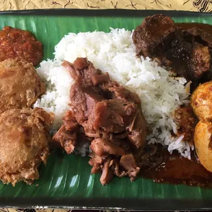 Beef rendang, chicken curry, potato, eggs, and jackfruit curry.