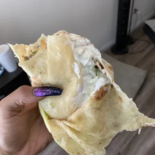 Sour cream throughout the ENTIRE burrito.