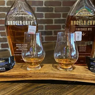 a bottle of angel&apos;s envy and two glasses