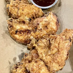 fried chicken with a side of dipping sauce