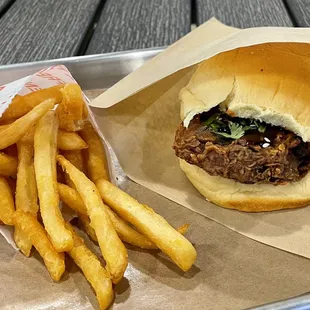 a sandwich and french fries on a tray