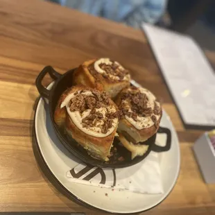 a plate of cinnamon rolls