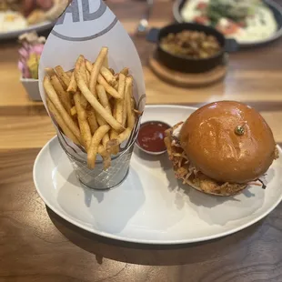 a burger and fries on a plate