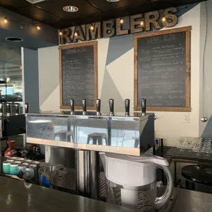 a counter with a coffee maker and a blender