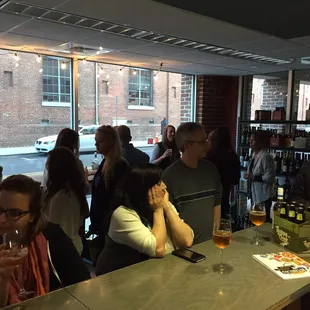 a group of people at a bar