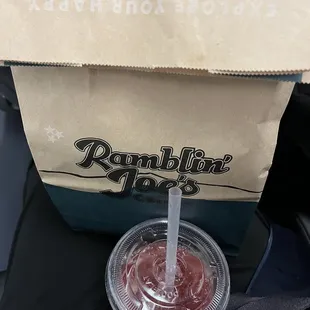 ws a drink in a paper cup