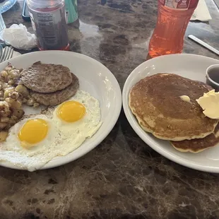 two plates of breakfast food