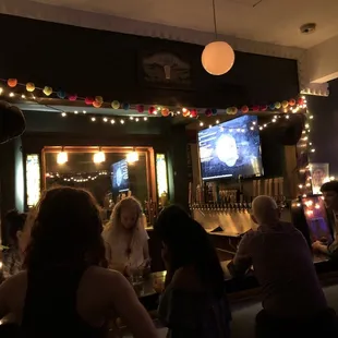 people sitting at a bar