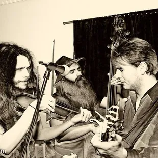 a man and woman playing instruments